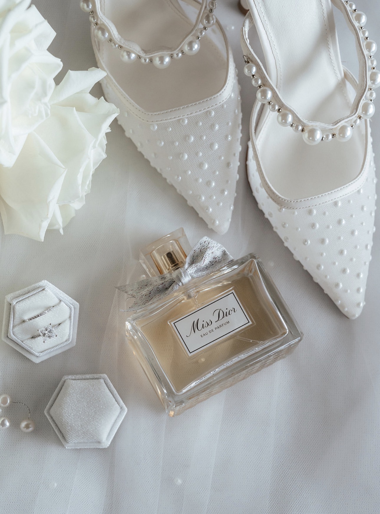 Bridal details with Miss Dior perfume and pearl shoes