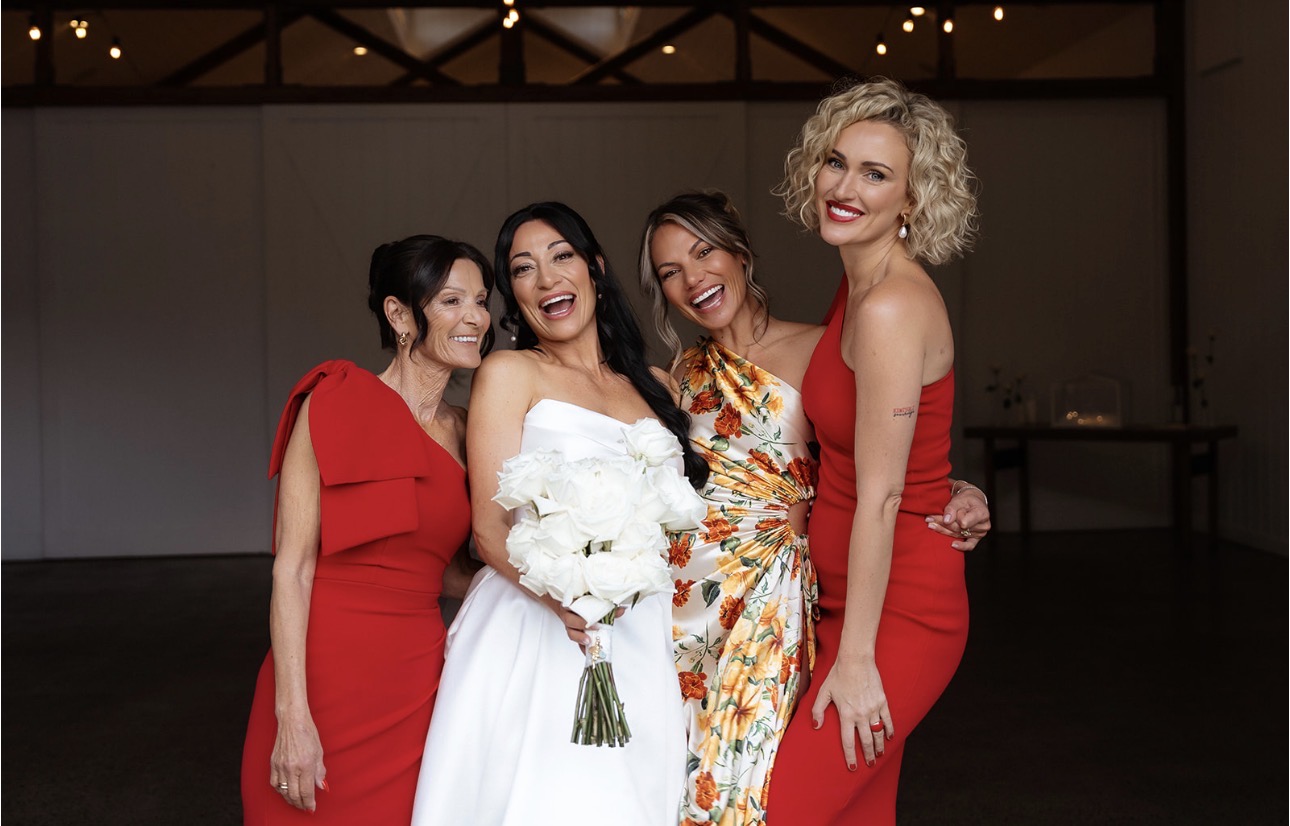 Mel with her bridesmaids laughing