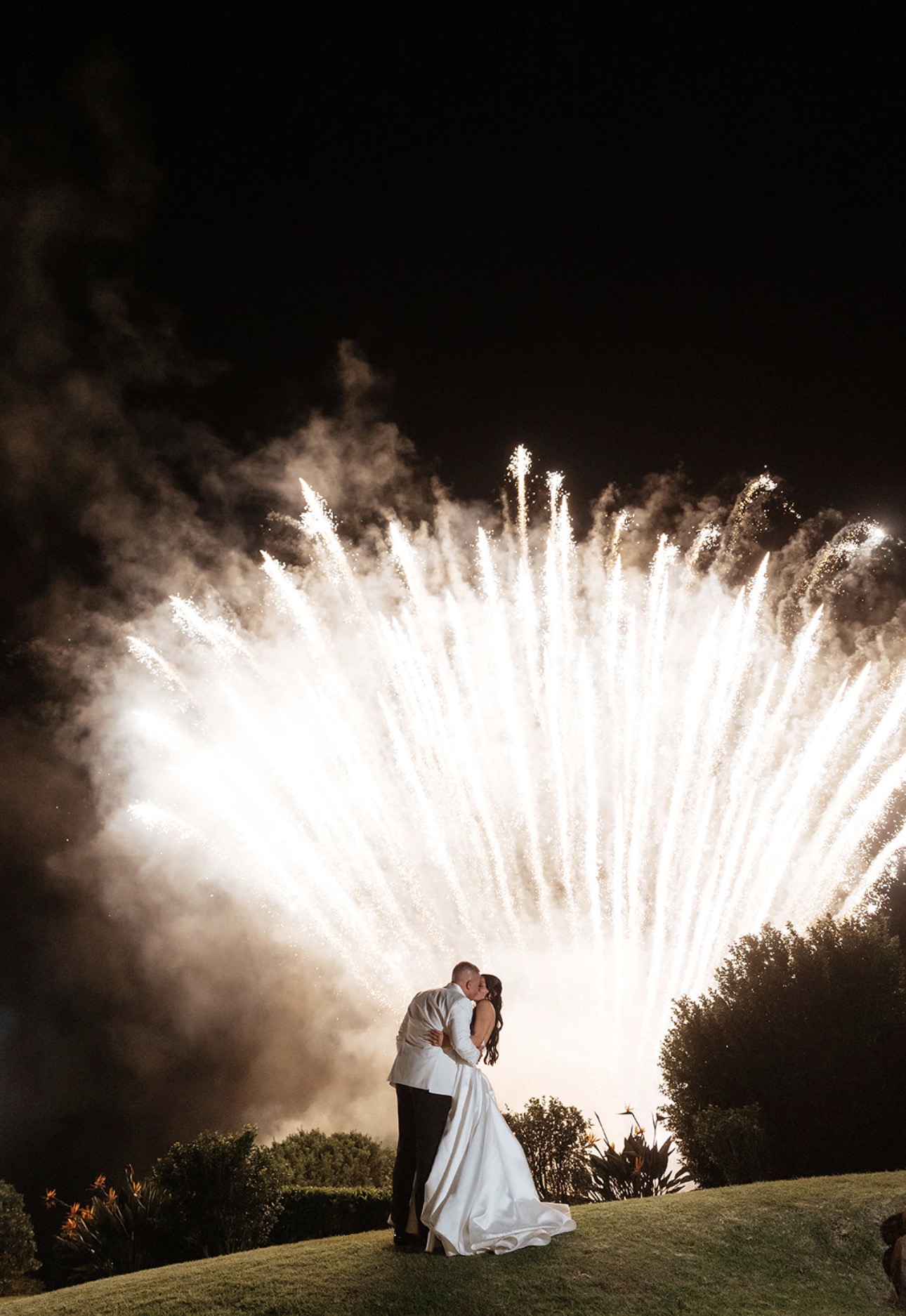 Mel and Cliffe kissing under the fireworks