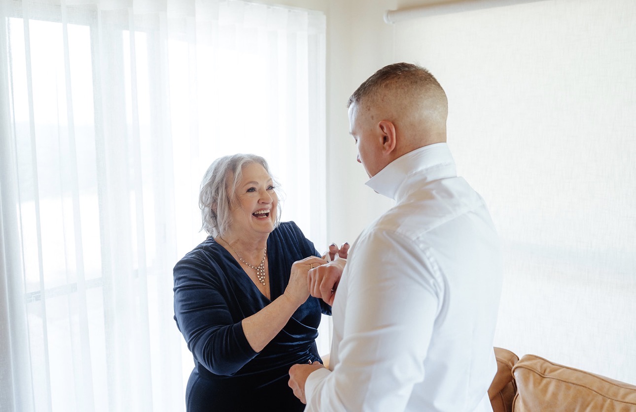Mother helping the groom get ready